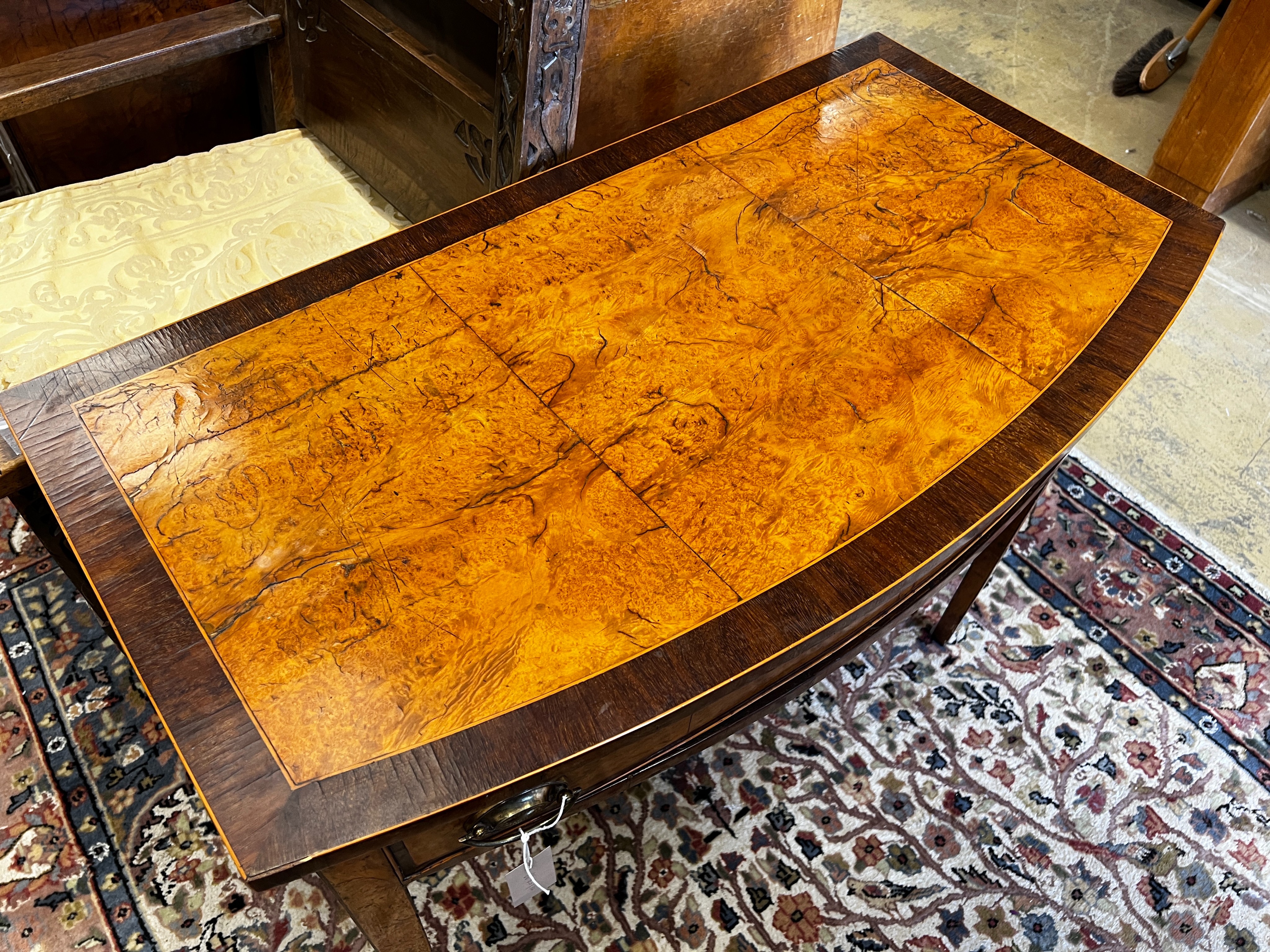 A George III rosewood banded bird's eye maple bowfront side table, width 91cm, depth 49cm, height 76cm